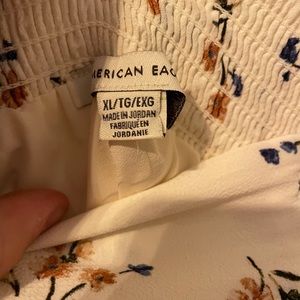 White and floral pants